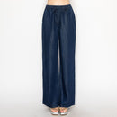 Pantalón de mezclilla con resorte y moño en color azul medio