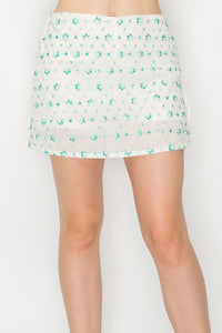 Minifalda bordada floral con transparencias