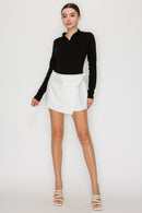 Blusa cuello alto con cierre frontal