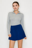 Blusa cuello alto con cierre frontal