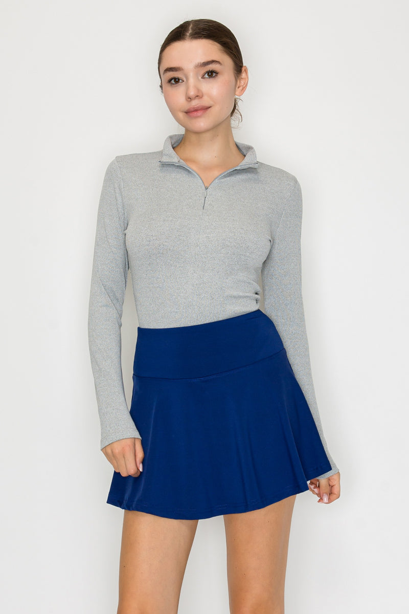 Blusa cuello alto con cierre frontal