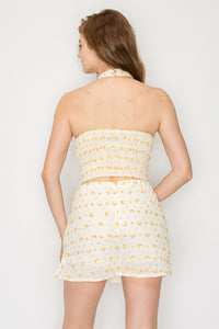 Top halter con bordado floral