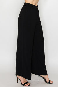 Pantalón negro de pierna ancha con resorte