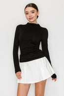 Blusa cuello alto drapeado manga larga
