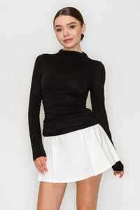 Blusa cuello alto drapeado manga larga