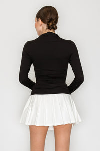 Blusa cuello alto drapeado manga larga