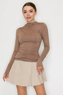 Blusa cuello alto drapeado manga larga
