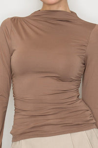 Blusa cuello alto drapeado manga larga