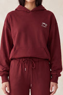 Sudadera con capucha y bordado de taza