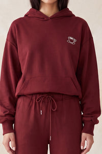 Sudadera con capucha y bordado de taza