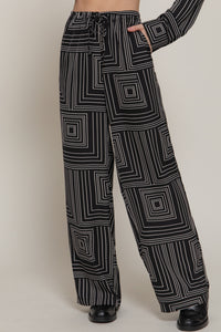 Pantalón amplio con estampado geométrico en blanco y negro