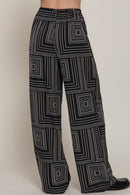 Pantalón amplio con estampado geométrico en blanco y negro