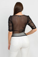 Blusa con textura y mangas de tres cuartos