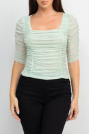 Blusa con textura y mangas de tres cuartos