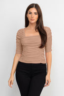 Blusa con textura y mangas de tres cuartos