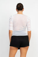 Blusa con textura y mangas de tres cuartos