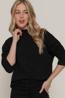 Blusa manga larga con cuello alto y costura central