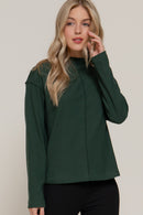 Blusa manga larga con cuello alto y costura central