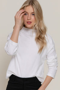 Blusa manga larga con cuello alto y costura central
